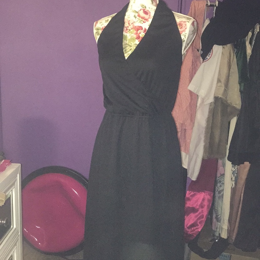 Black halter dress, ties at neck.